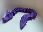 3d printed flexi dragons (wyrms of various colors)